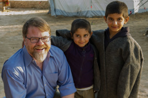 Patrick Ball with Yezidi boys at an informal camp in Sharya, Iraq.