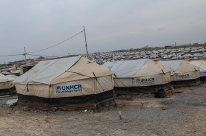 Formal camp with running water and electricity, where tents are built on concrete pads.